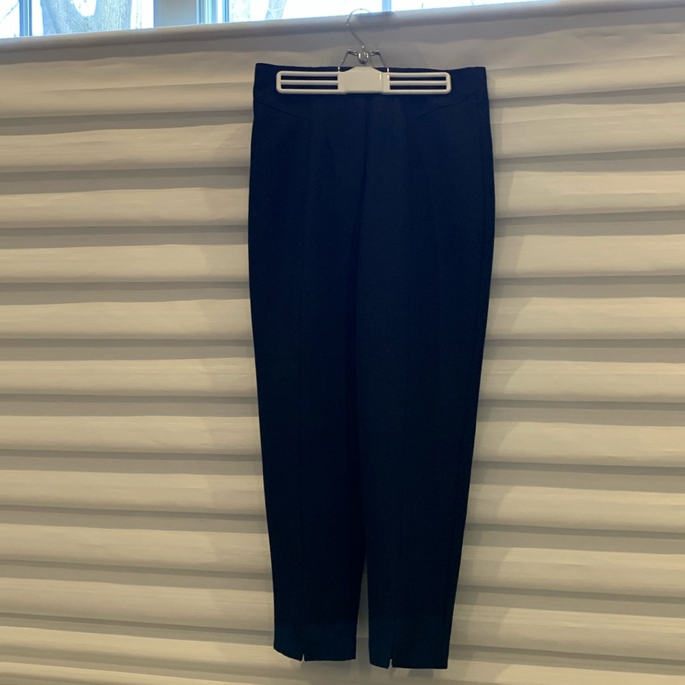 Navy poly slacks. Tapered to ankles. Slits at Ankles.